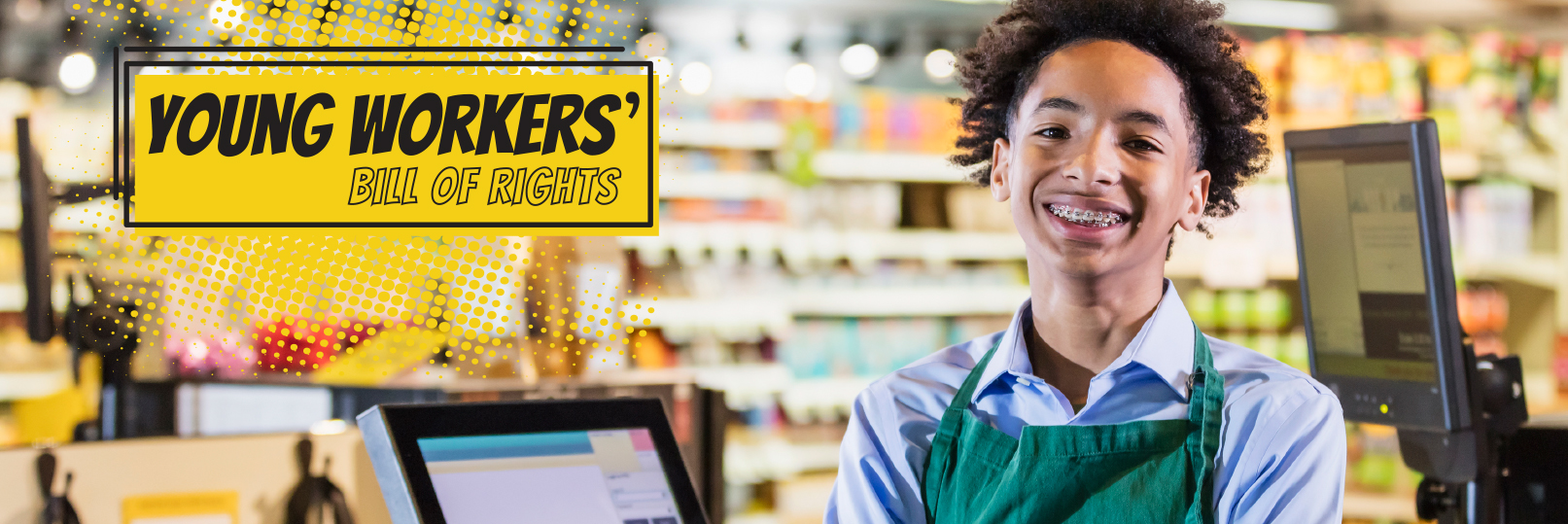 a teenager grocery store clerk smiling at work